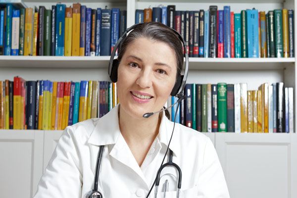Doctor using VoiP service with patient